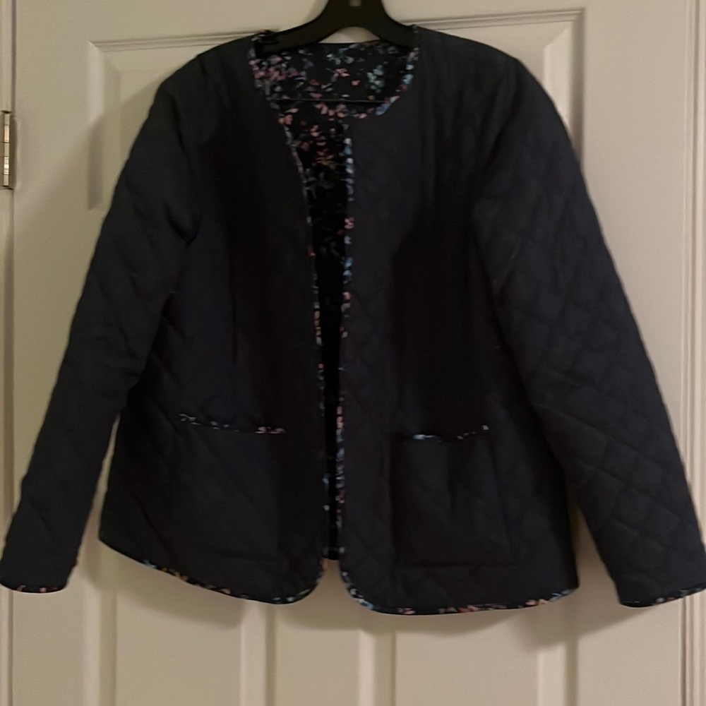 Quilted navy blue reversible jacket. Floral on 2nd side.  Excellent condition.